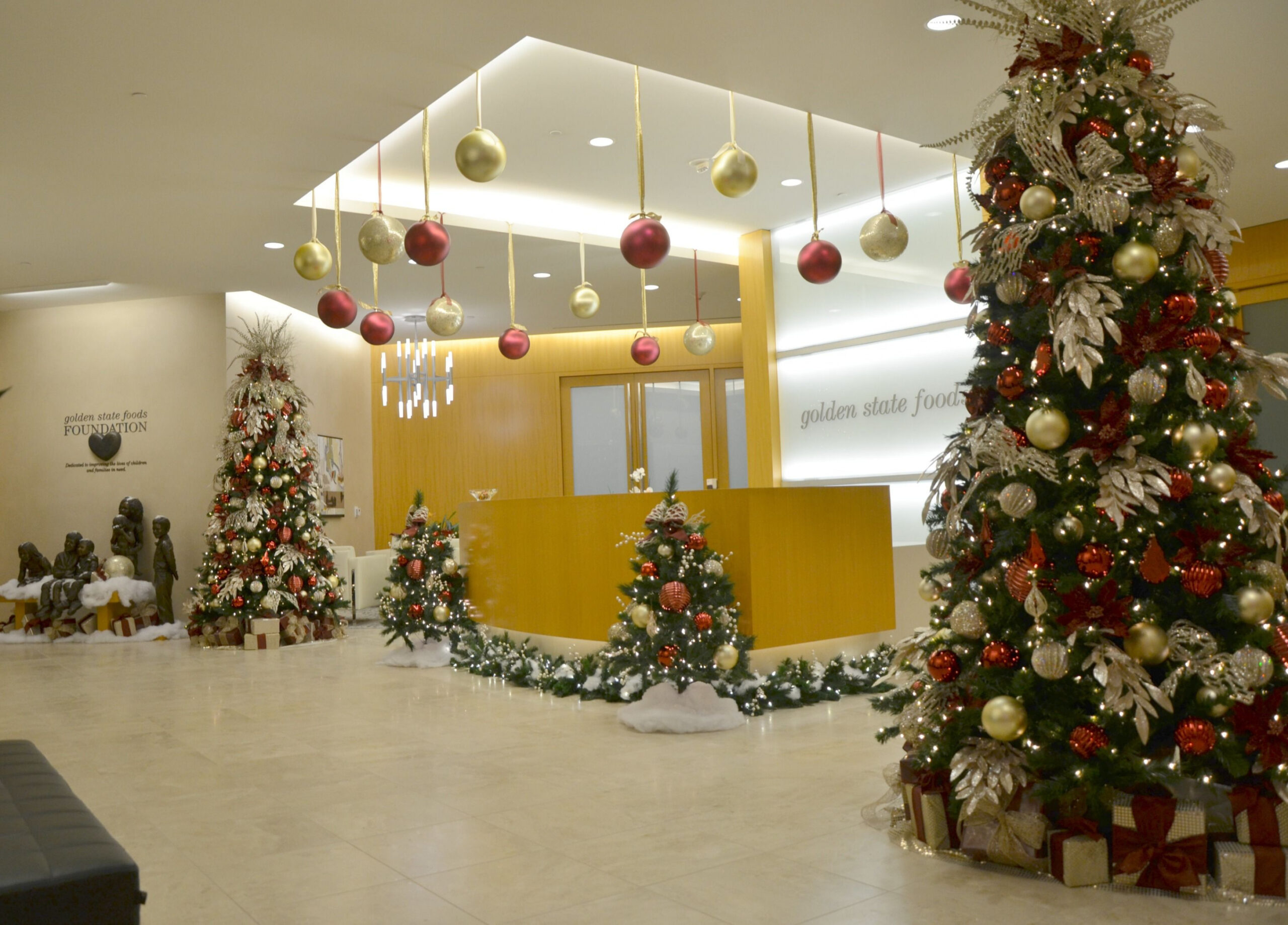 champagne gold and burgundy decorated christmas tree rental, lobby