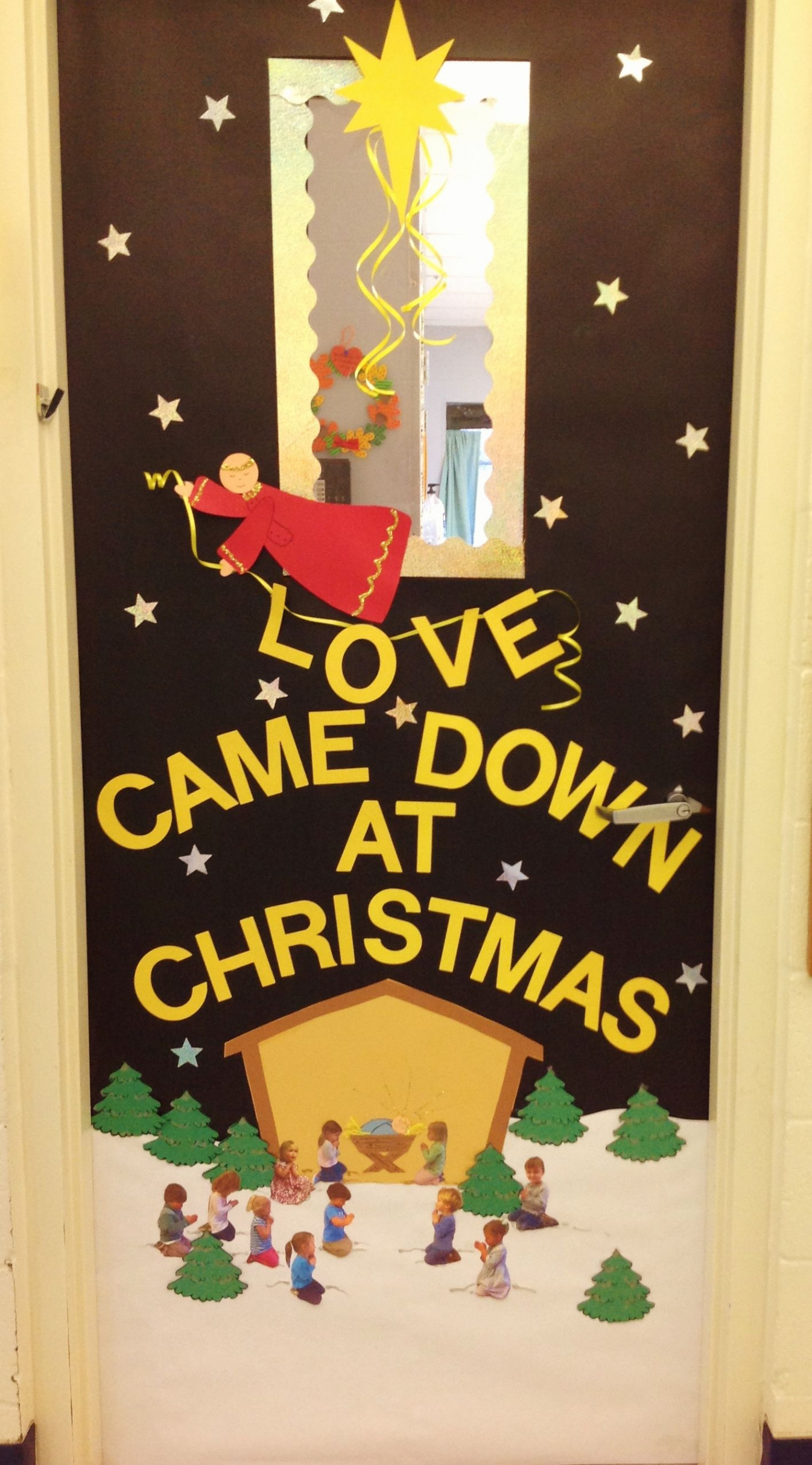 Christmas Door- Glitter stars and an angel announcing "Love Came