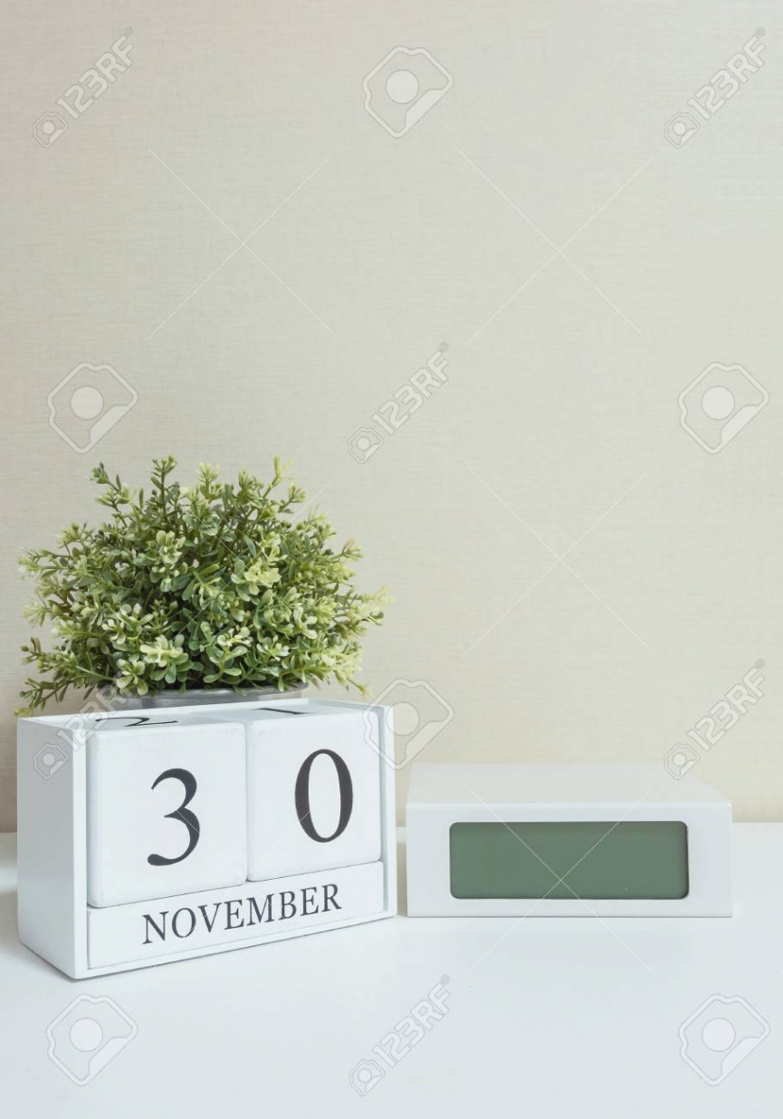 White Wooden Calendar With Black  November Word With Clock And