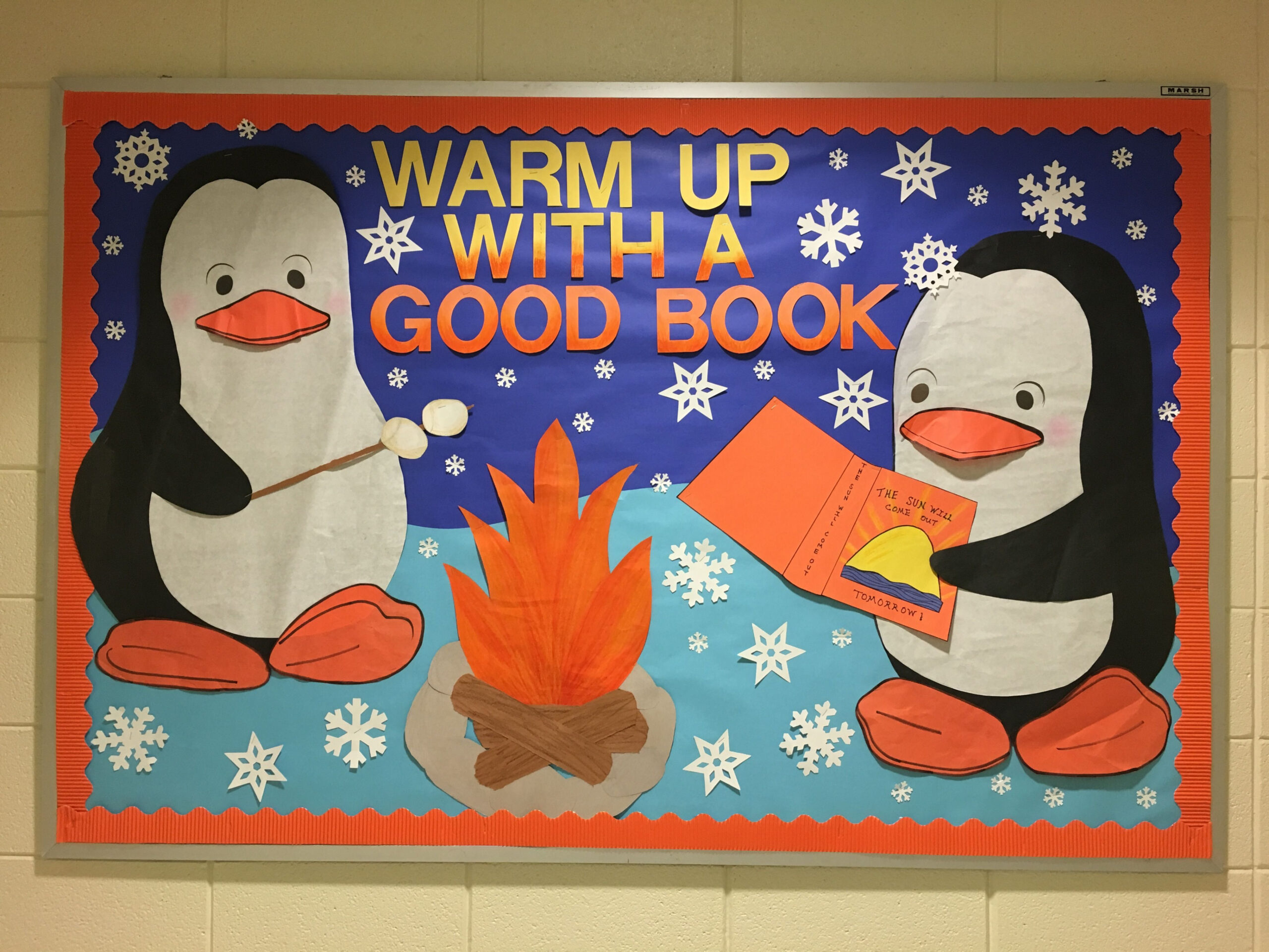 Winter school library bulletin board Warm up with a good book